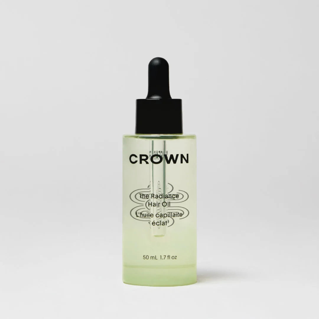 An oil bottle on a neutral surface